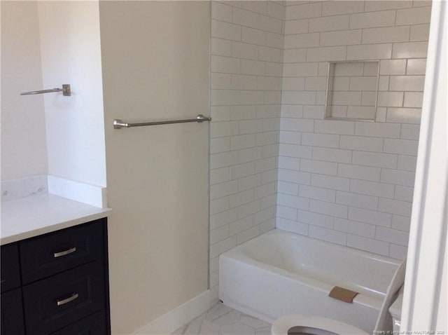 full bath featuring baseboards, toilet, and vanity