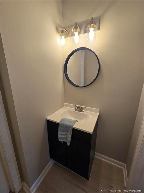 bathroom with baseboards and vanity