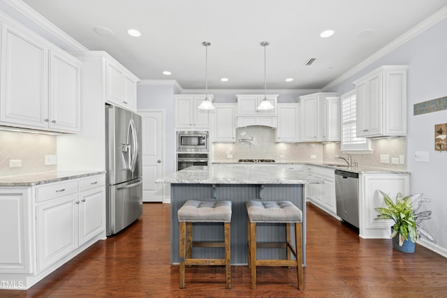 kitchen featuring visible vents, dark wood-style floors, a center island, white cabinetry, and stainless steel appliances