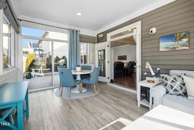 sunroom / solarium featuring french doors