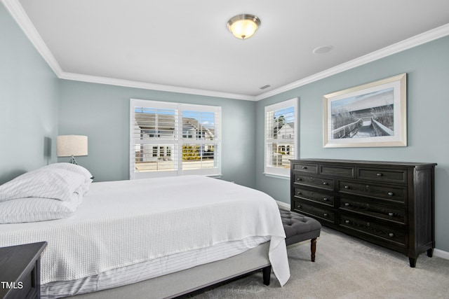 bedroom with light carpet, crown molding, and baseboards