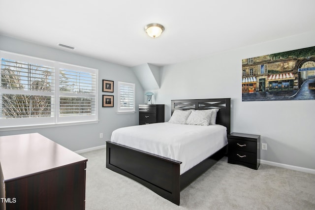 bedroom featuring visible vents, baseboards, and carpet