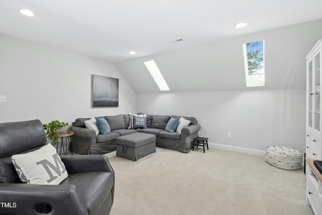 carpeted living room with recessed lighting, baseboards, vaulted ceiling with skylight, and visible vents