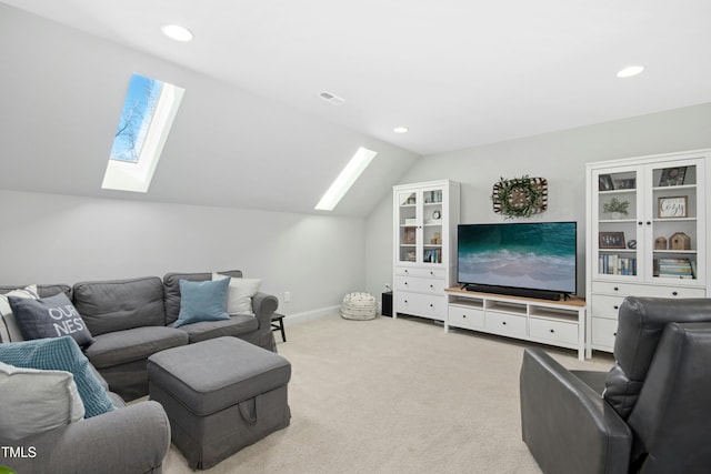 living room with visible vents, baseboards, lofted ceiling with skylight, carpet floors, and recessed lighting