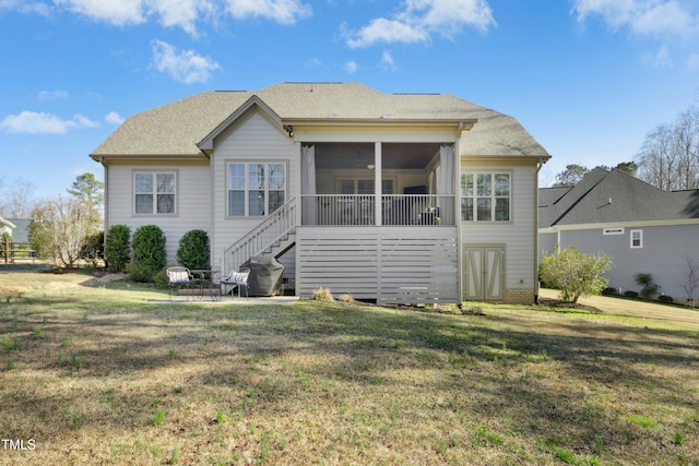 back of house with a patio, stairway, a yard, and a sunroom