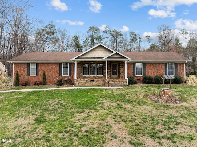 ranch-style home with a shingled roof, a front lawn, brick siding, and crawl space