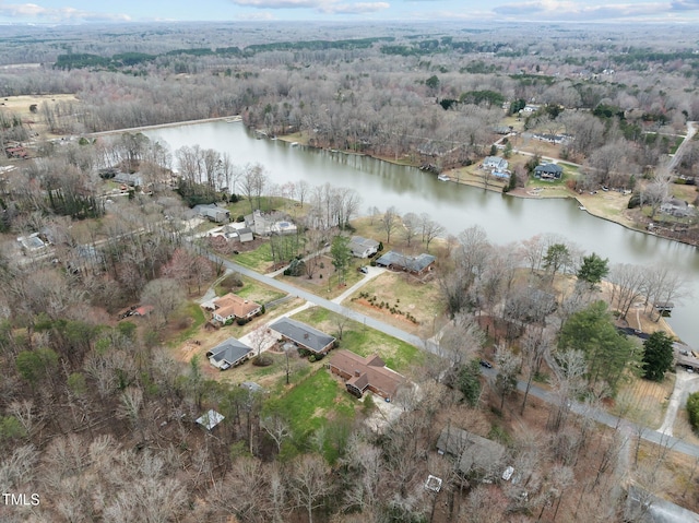 aerial view featuring a forest view and a water view