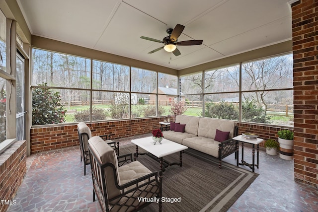 sunroom with ceiling fan