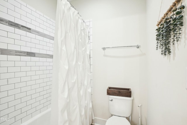 bathroom with toilet and shower / bath combo