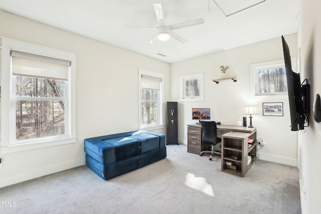 carpeted home office featuring visible vents, ceiling fan, attic access, and baseboards