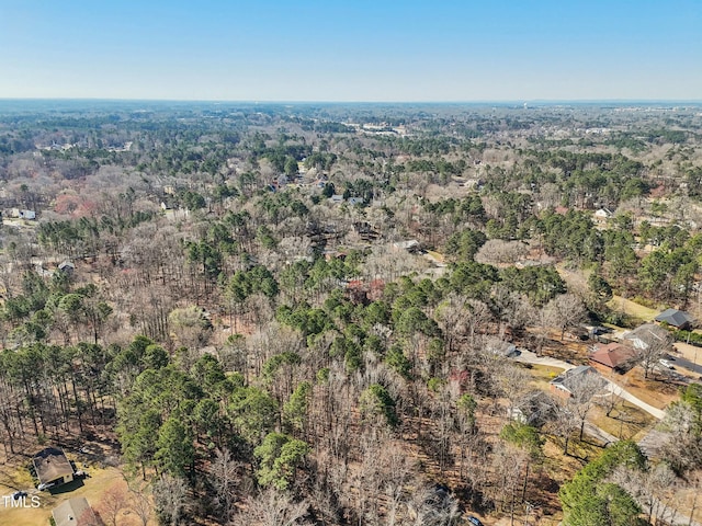 drone / aerial view featuring a view of trees