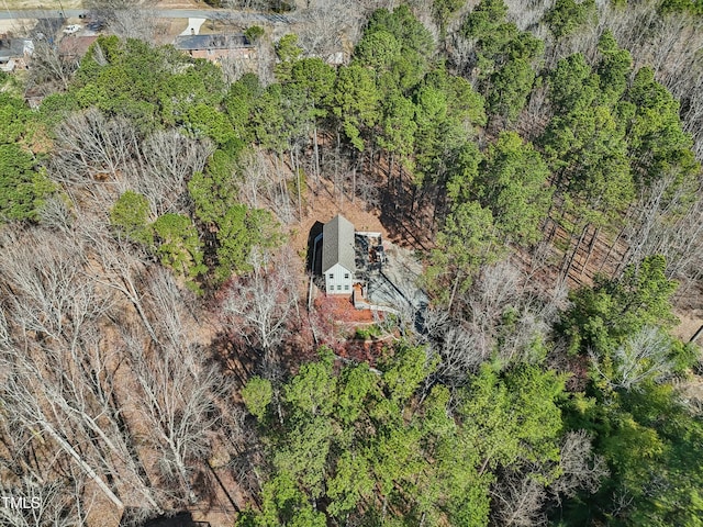 birds eye view of property with a view of trees