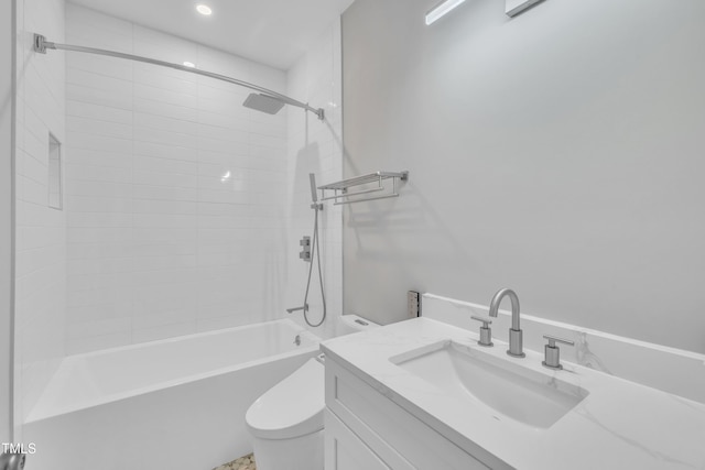 bathroom featuring toilet, vanity, and  shower combination