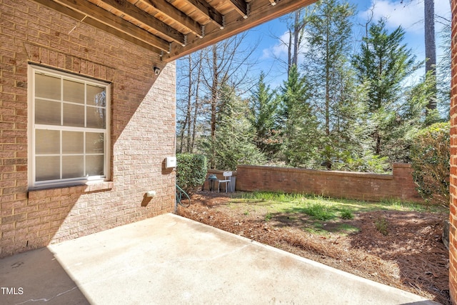 view of patio / terrace featuring fence