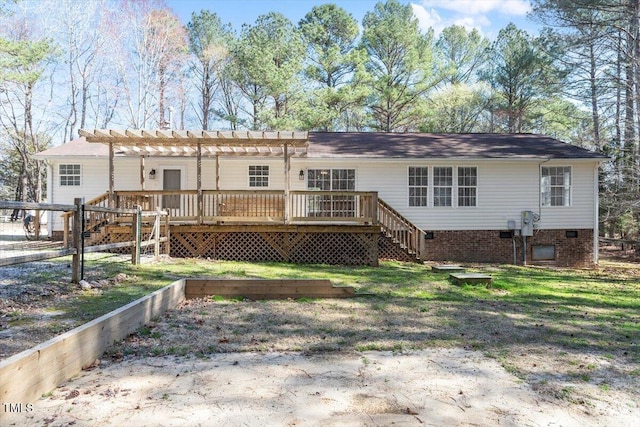 back of house featuring crawl space, a lawn, a deck, and a pergola