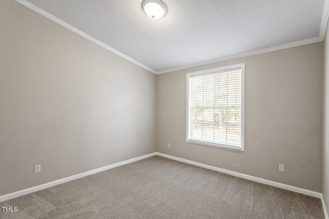 carpeted spare room featuring baseboards, a textured ceiling, and crown molding