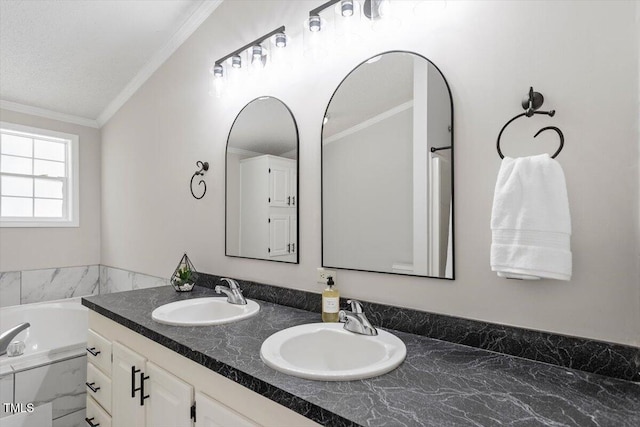 bathroom with a sink, a bathing tub, double vanity, and crown molding