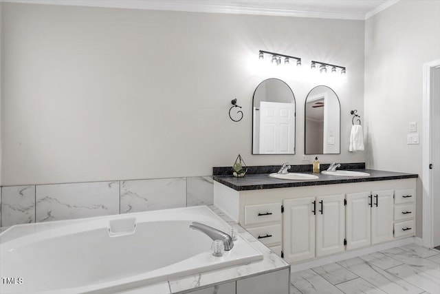 bathroom featuring a bath, marble finish floor, vanity, and crown molding