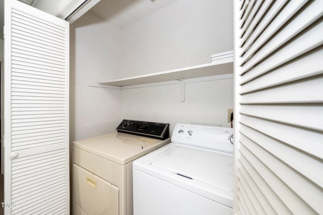 laundry area with laundry area and independent washer and dryer