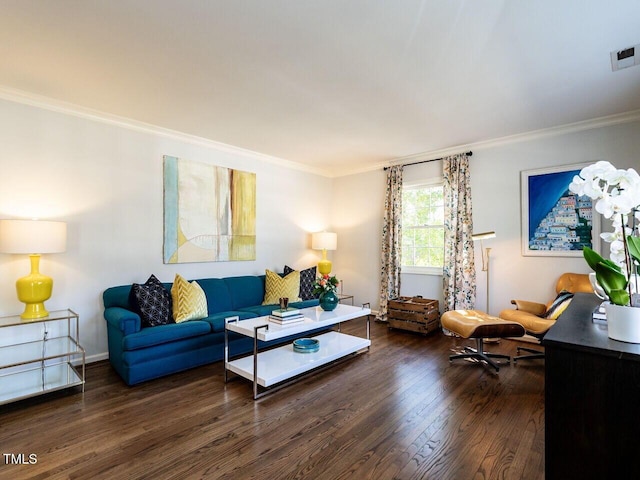 living room featuring visible vents, baseboards, wood finished floors, and crown molding