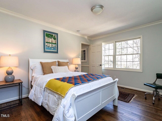 bedroom featuring crown molding, wood finished floors, and baseboards