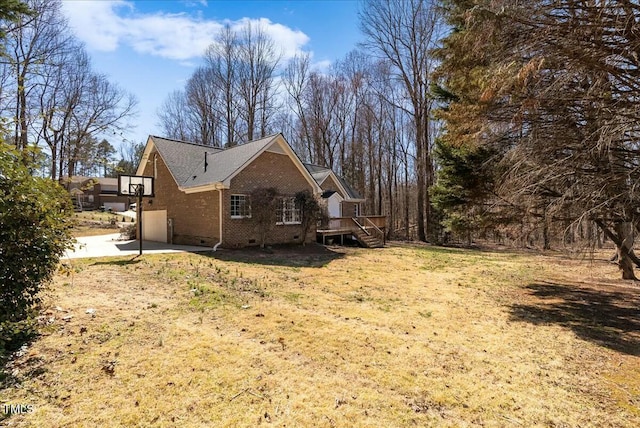 view of home's exterior with brick siding and crawl space