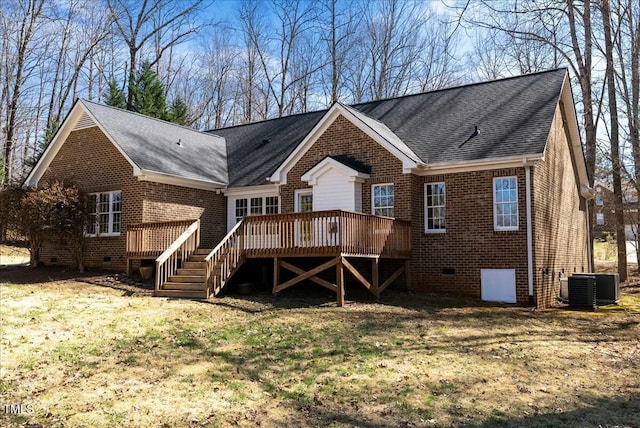 back of house featuring a lawn, a deck, crawl space, brick siding, and central AC unit