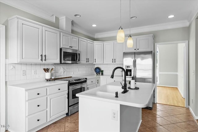 kitchen featuring tasteful backsplash, appliances with stainless steel finishes, crown molding, and a sink