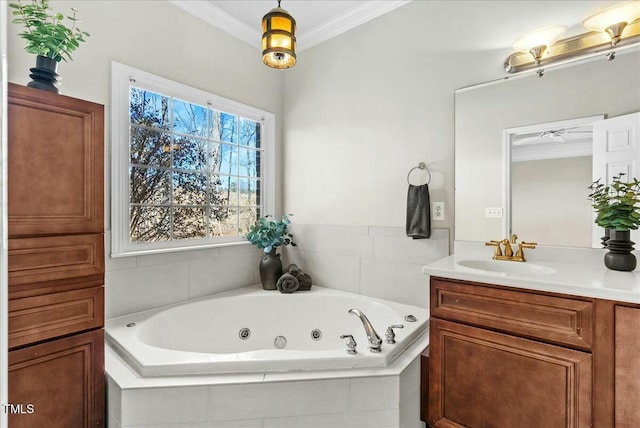 full bath with vanity, crown molding, and a whirlpool tub