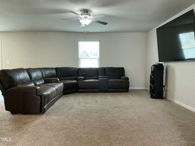 living room featuring light carpet, ceiling fan, and baseboards