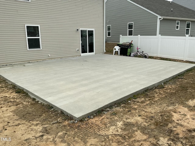 exterior space with a patio and fence