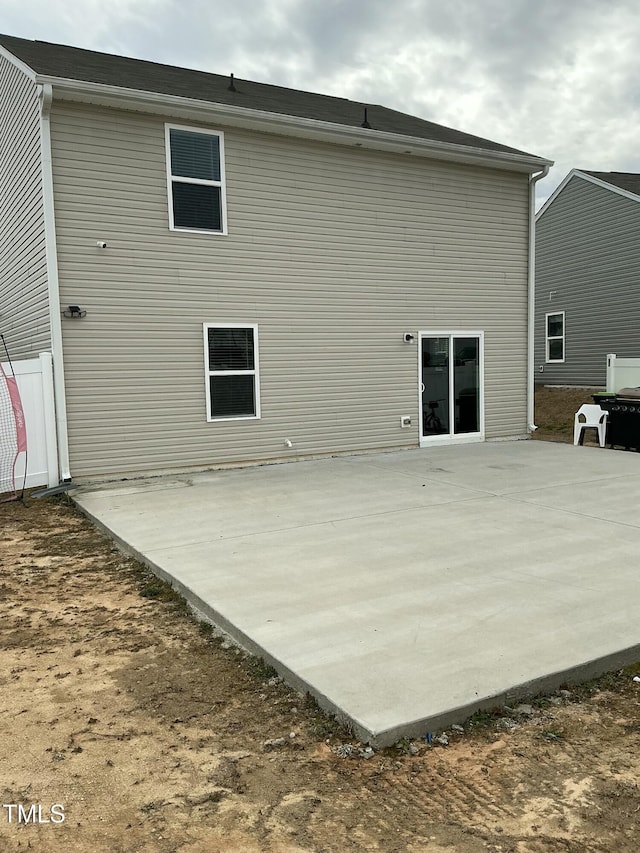 back of property featuring a patio