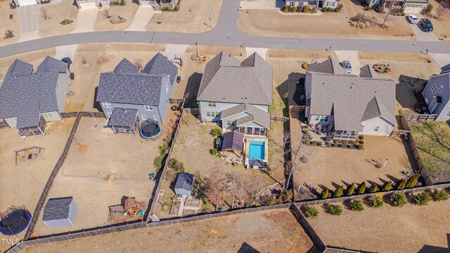 birds eye view of property with a residential view