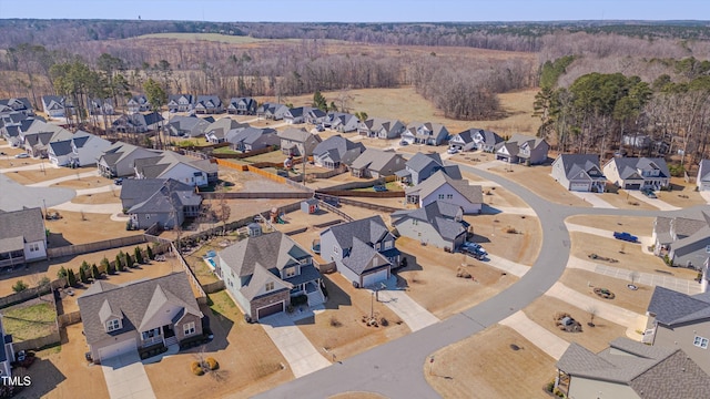 birds eye view of property with a residential view and a view of trees