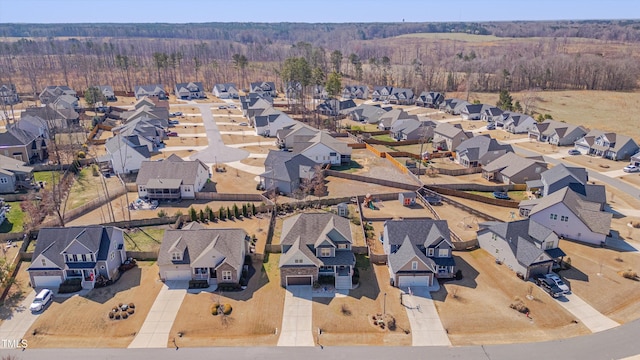 bird's eye view with a residential view and a view of trees