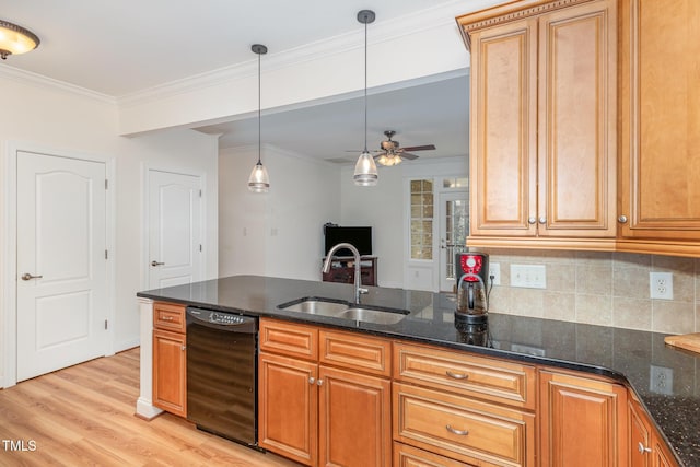 kitchen with dark stone counters, crown molding, black dishwasher, and a sink