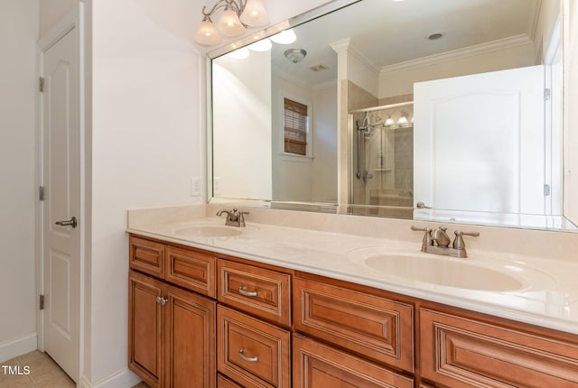 full bath with a stall shower, crown molding, and a sink