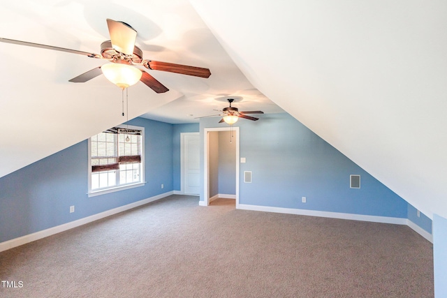 additional living space with visible vents, baseboards, carpet floors, and a ceiling fan