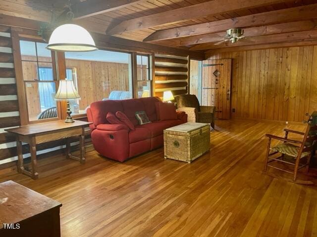 182 Tree Cutters, Sanford, NC 27332 - living area featuring hardwood / wood-style flooring, wood walls, and wooden ceiling with exposed beams