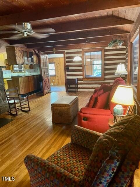 182 Tree Cutters, Sanford, NC 27332 - living area with wood finished floors, wooden walls, wood ceiling with exposed beams, healthy amount of natural light, and ceiling fan
