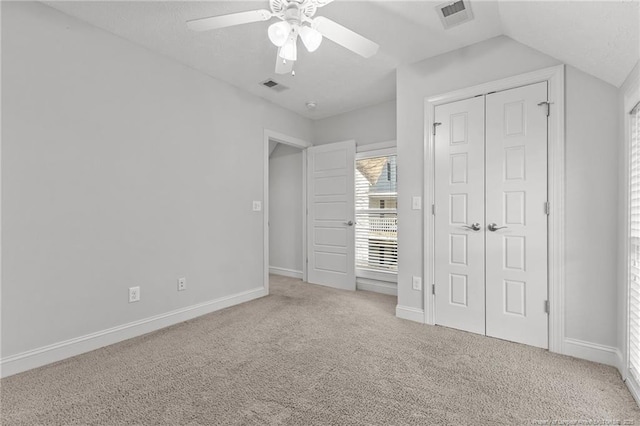 unfurnished bedroom with a closet, baseboards, visible vents, and carpet floors