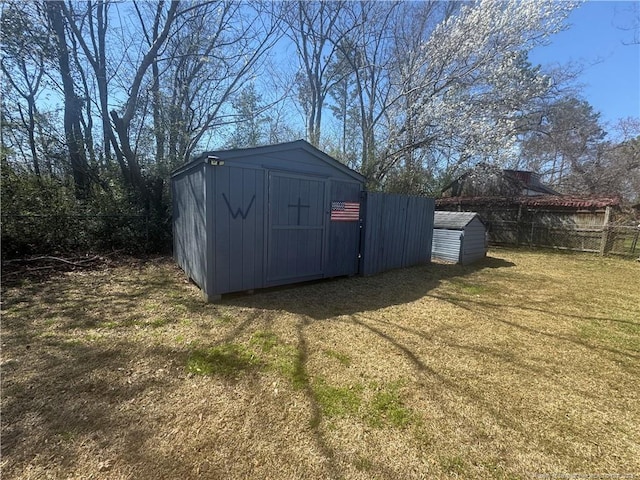 view of shed with a fenced backyard