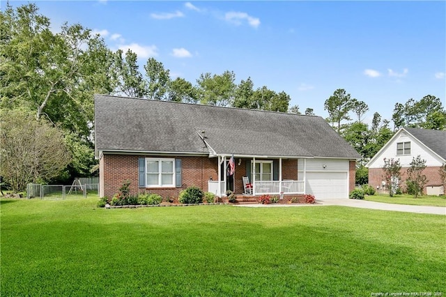 view of front facade featuring driveway, a porch, an attached garage, a front yard, and brick siding