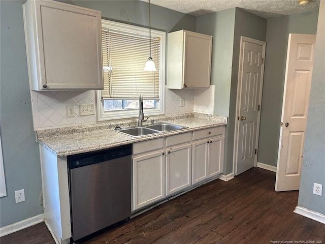 kitchen with dark wood-style floors, a sink, baseboards, and stainless steel dishwasher