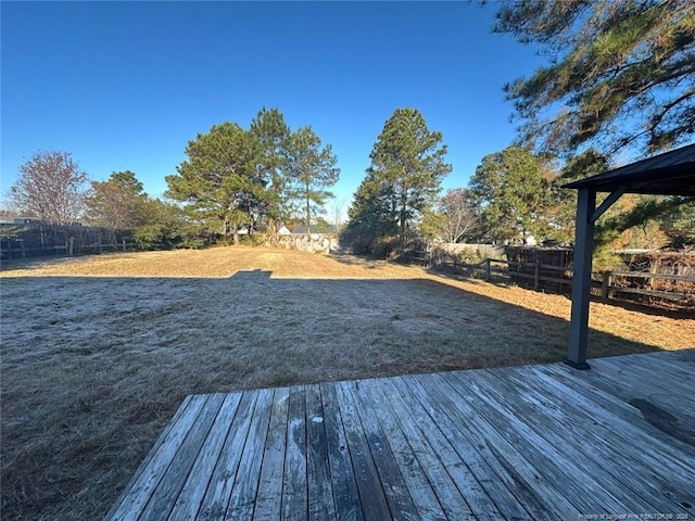 exterior space featuring a deck and fence