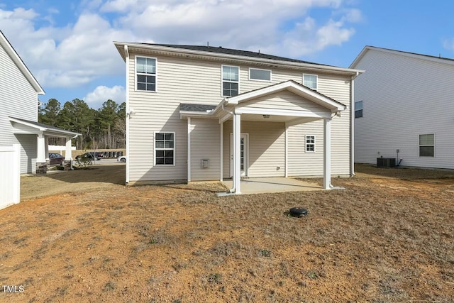 rear view of house with a patio and central air condition unit