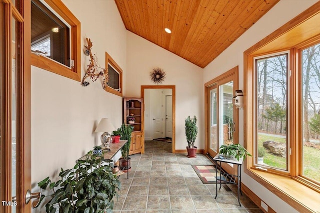 sunroom featuring wood ceiling and lofted ceiling