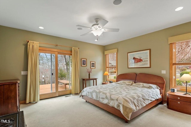 carpeted bedroom with access to exterior, visible vents, multiple windows, and recessed lighting