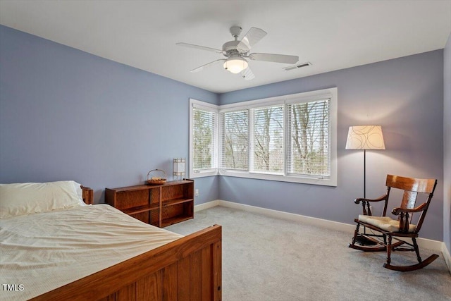 bedroom with visible vents, carpet floors, baseboards, and a ceiling fan