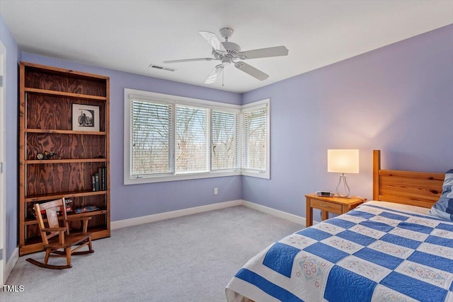 bedroom featuring visible vents, baseboards, ceiling fan, and carpet flooring